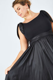 Model Fiona wearing size 16 of the Chloe Dress in colour Black (Black), from the front, cropped image