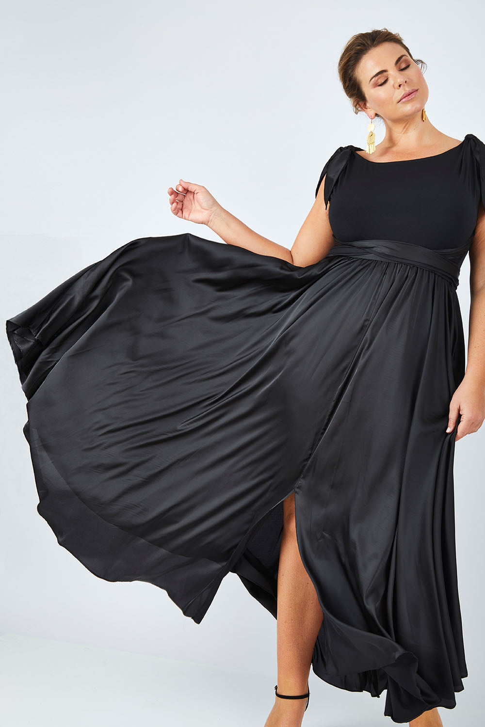 Model Fiona wearing size 16 of the Chloe Dress in colour Black (Black), from the front, showing the whole outfit