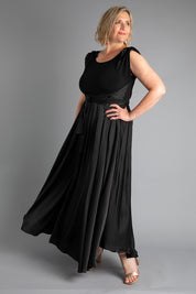 A model wearing size 16 of the Chloe Dress in colour Black (Black), from the front, showing the whole outfit