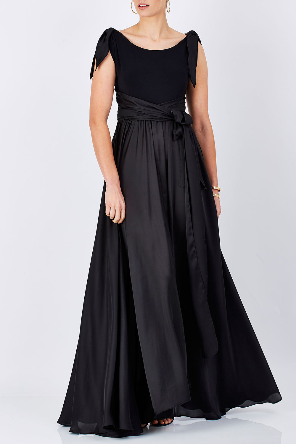 Model Maddy wearing size 10 of the Chloe Dress in colour Black (Black), from the front, cropped image