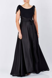Model Maddy wearing size 10 of the Chloe Dress in colour Black (Black), from the front, cropped image