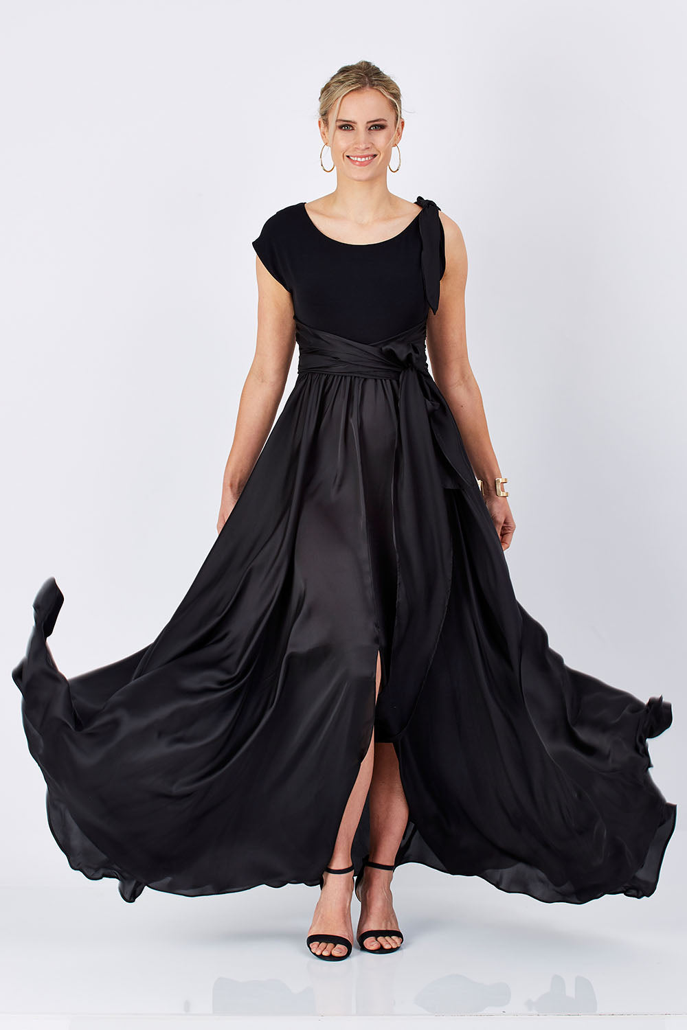 Model Maddy wearing size 10 of the Chloe Dress in colour Black (Black), from the front, showing the whole outfit