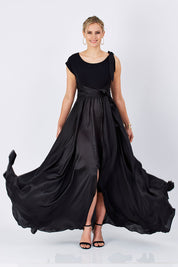 Model Maddy wearing size 10 of the Chloe Dress in colour Black (Black), from the front, showing the whole outfit
