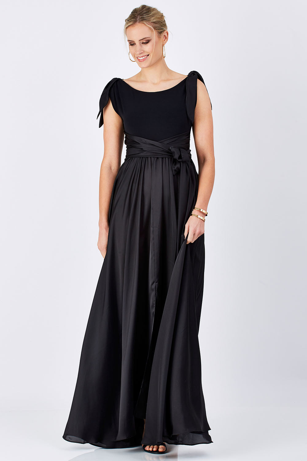 Model Maddy wearing size 10 of the Chloe Dress in colour Black (Black), from the front, showing the whole outfit