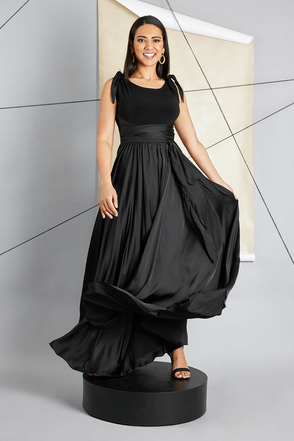 Model Pamela wearing size 10 of the Chloe Dress in colour Black (Black), from the front, showing the whole outfit