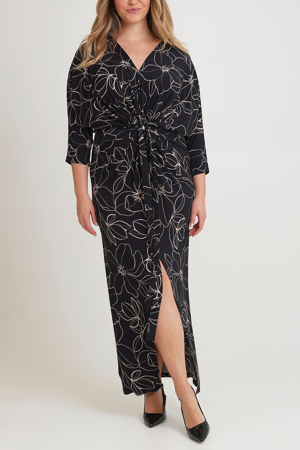 Model Chanel wearing size 16 of The Printed Nadine Dress in colour Magnolia (Black), from the front, cropped image
