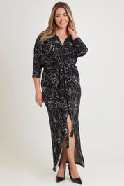 Model Chanel wearing size 16 of The Printed Nadine Dress in colour Magnolia (Black), from the front, showing the whole outfit
