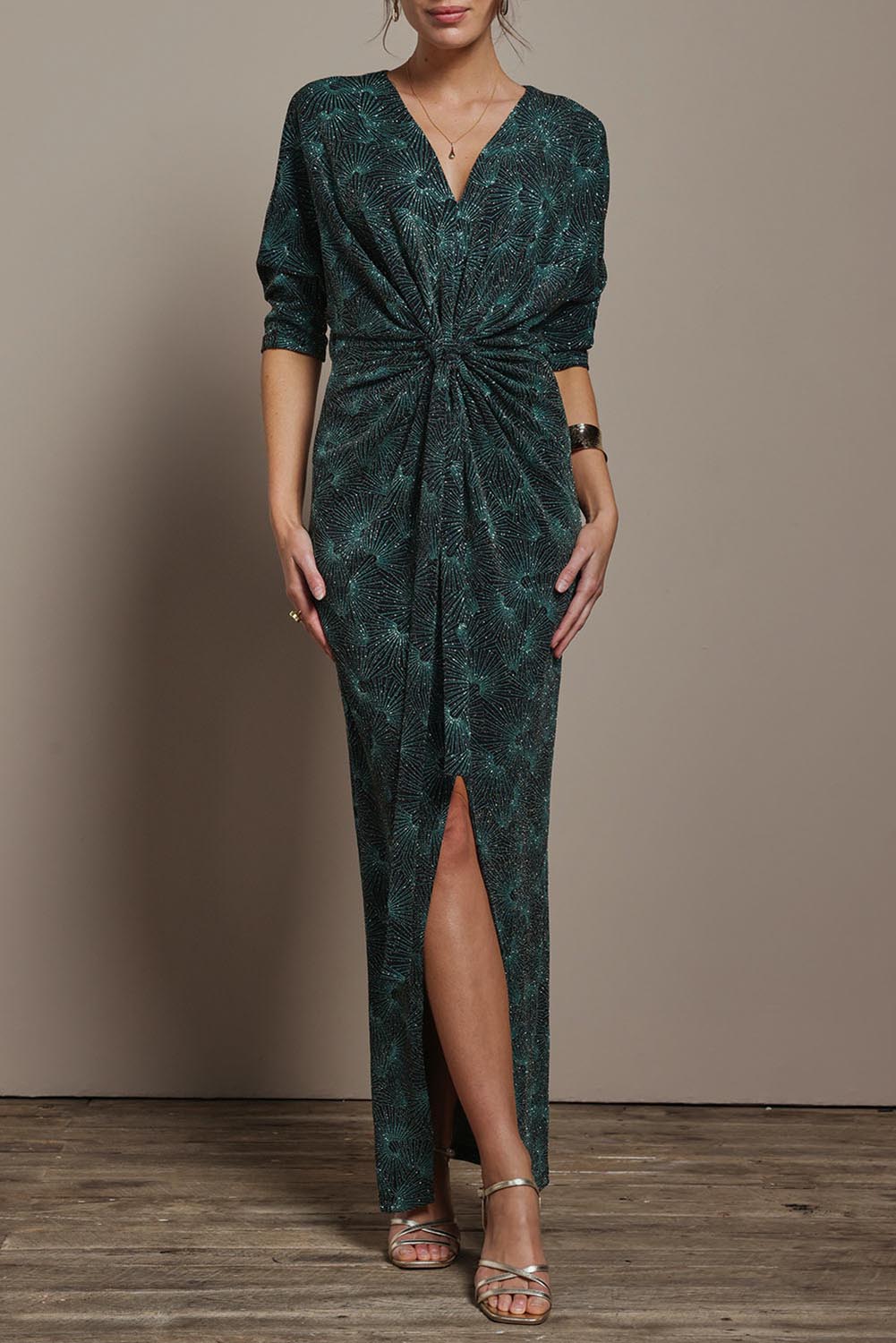 Model Madeline wearing size 10 of The Printed Nadine Dress in colour Jadebling (Green), from the front, cropped image