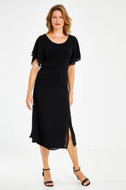 Model Naomi wearing size 10 of the Brenda Top in colour Black (Black), from the front, showing the whole outfit