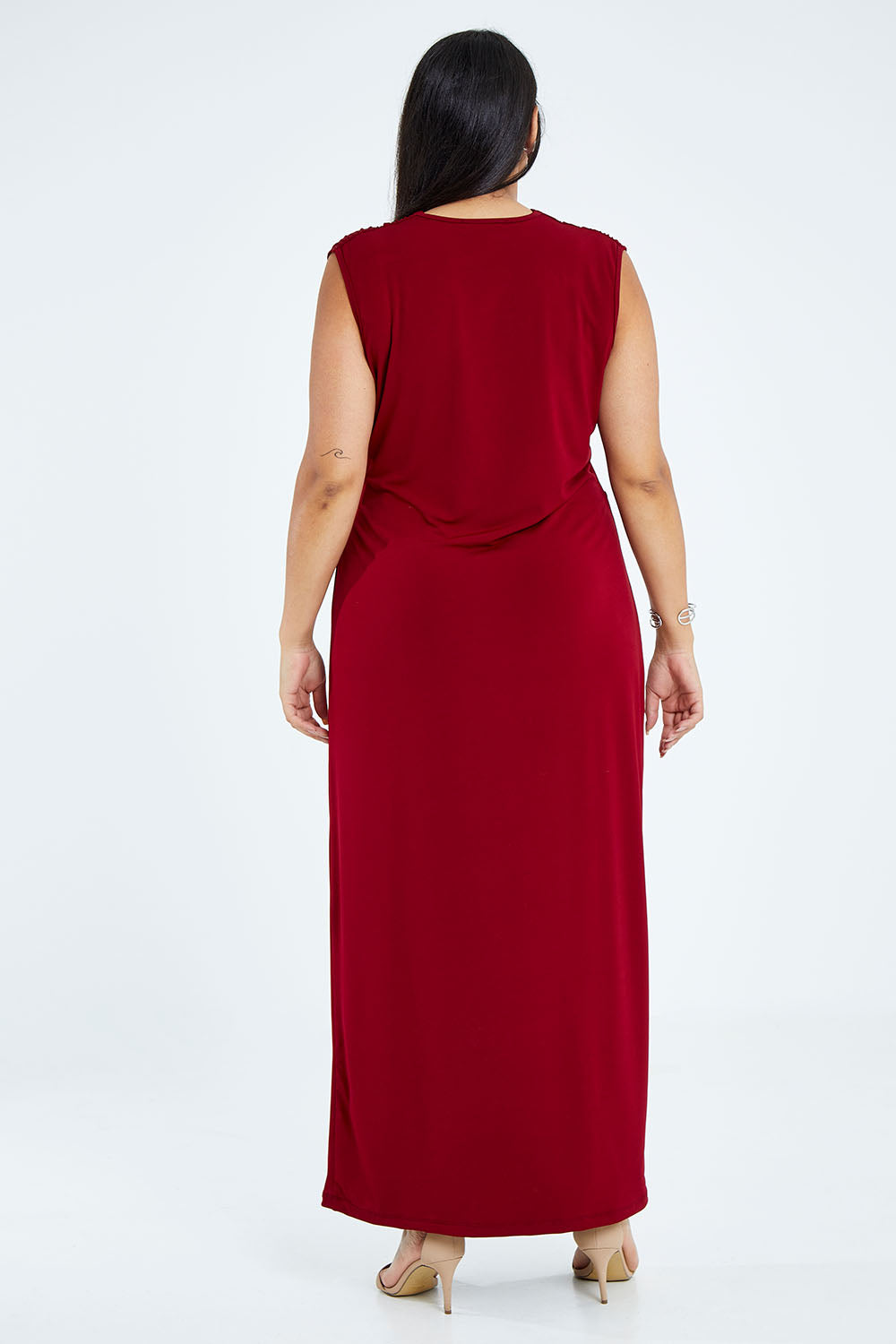 Model Sasha-Lee wearing size 16 of the Elisha Dress in colour Flamenco (Red), from the back