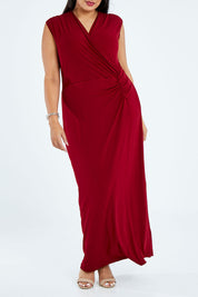 Model Sasha-Lee wearing size 16 of the Elisha Dress in colour Flamenco (Red), from the front, cropped image