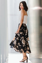 Model Andrea wearing size 10 of the Samara Skirt in colour Disbud (Black), from the front, showing the whole outfit
