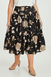 Model Fiona wearing size 16 of the Samara Skirt in colour Disbud (Black), from the front, cropped image