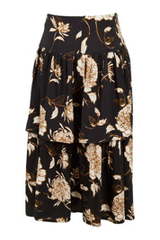 Product shot of the Samara Skirt in colour Disbud (Black), from the back