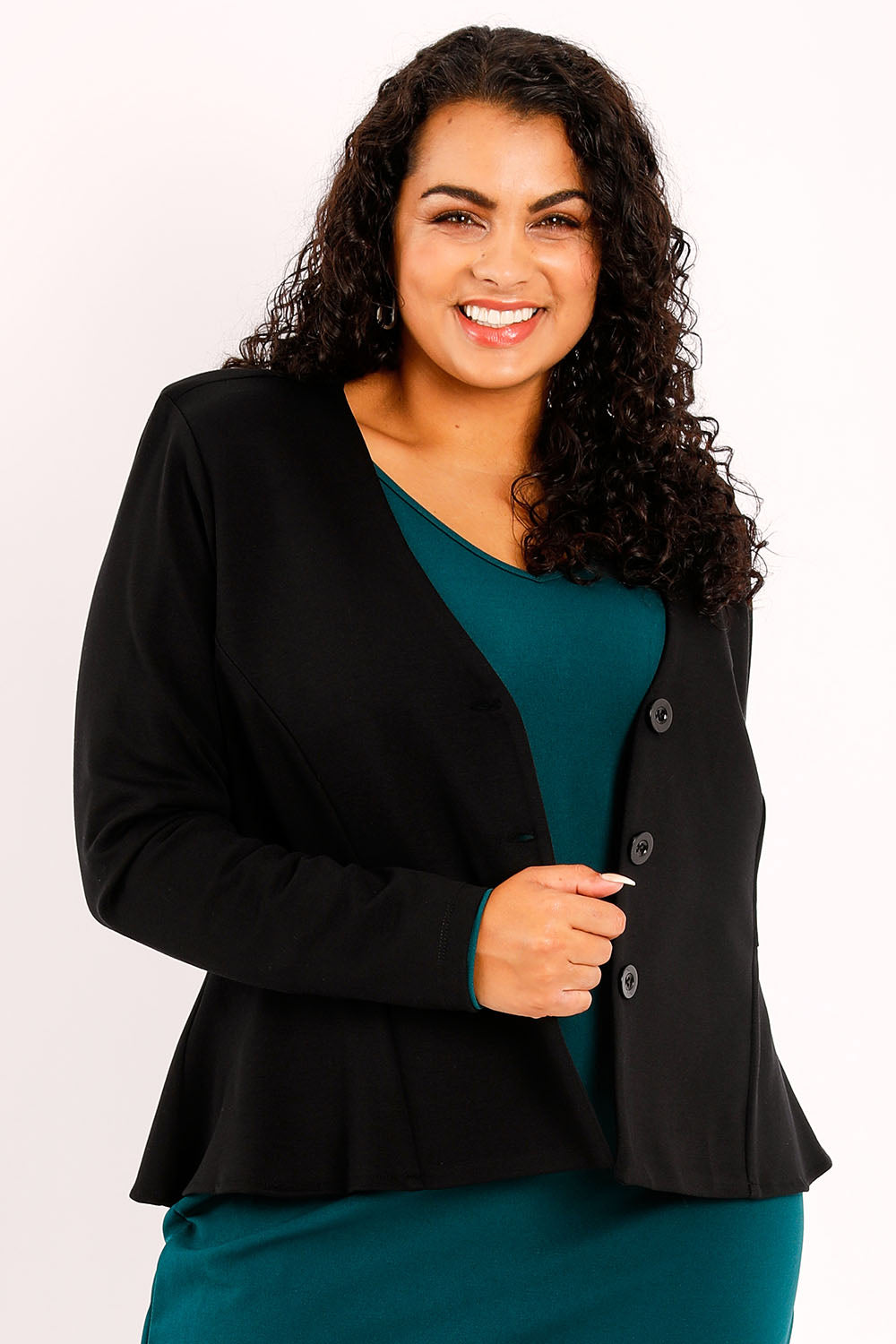 Model Sasha-Lee wearing size 16 of the Jamie Jacket in colour Black (Black), from the front, cropped image