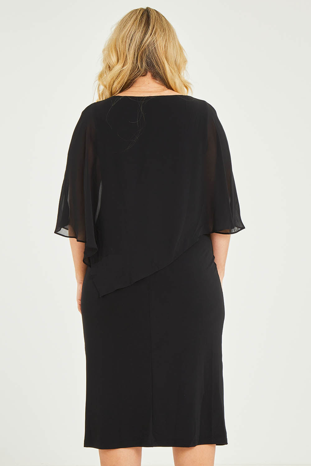 Model Katie wearing size 16 of the Cassandra Dress in colour Black (Black), from the back