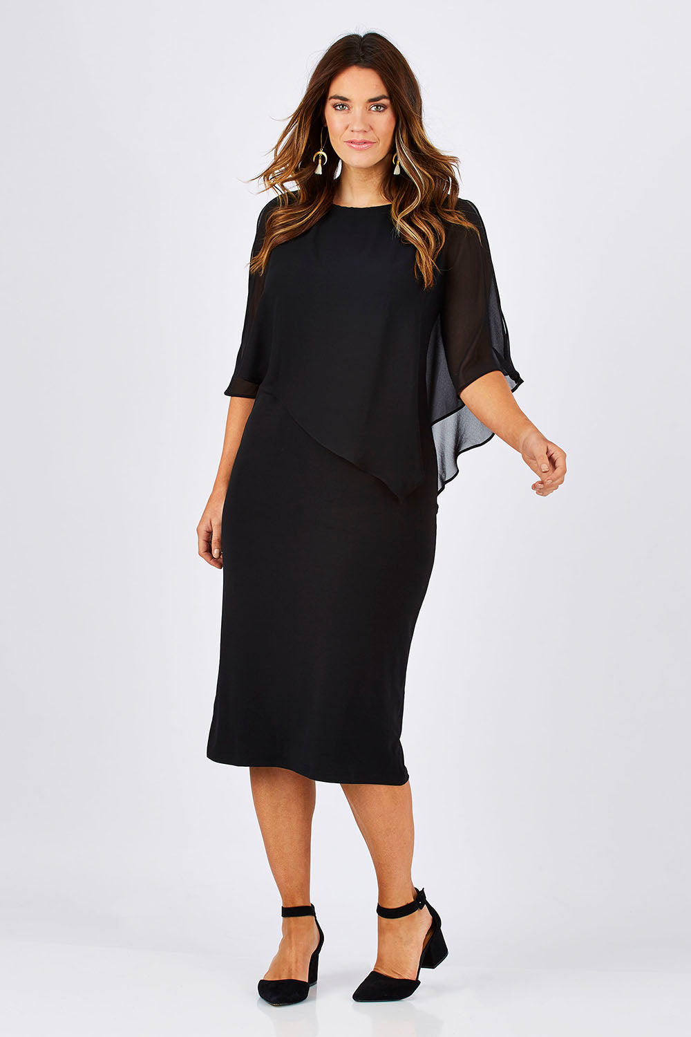 Model Laura wearing size 12 of the Cassandra Dress in colour Black (Black), from the front, showing the whole outfit