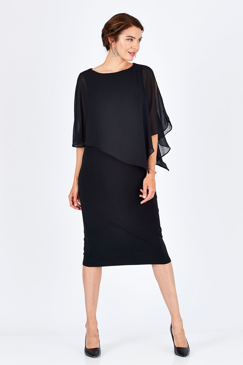 Model Rebecca wearing size 10 of the Cassandra Dress in colour Black (Black), from the front, showing the whole outfit