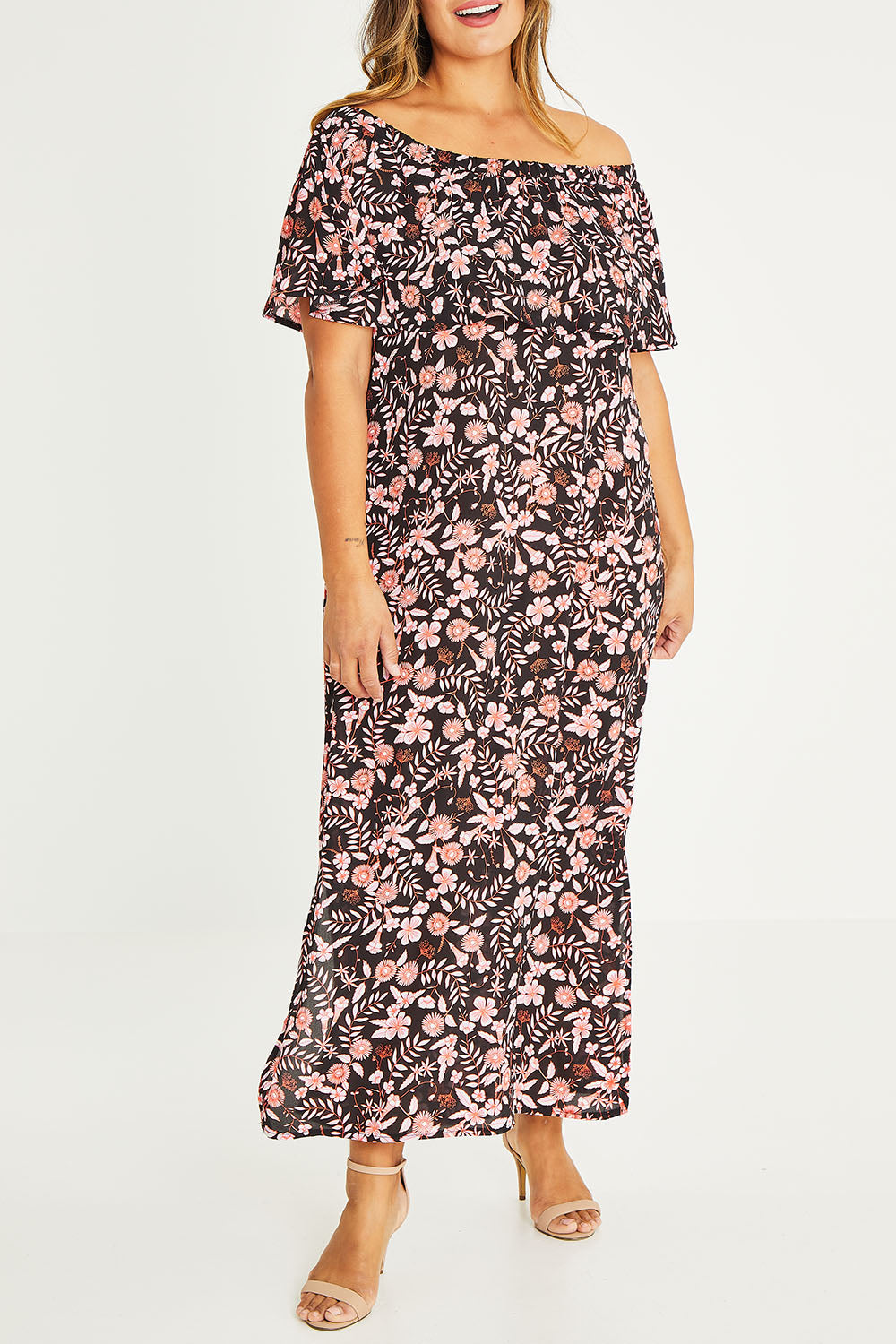 Model Palatina wearing size 16 of The Printed Isabel Dress in colour Summertime (Black), from the front, cropped image