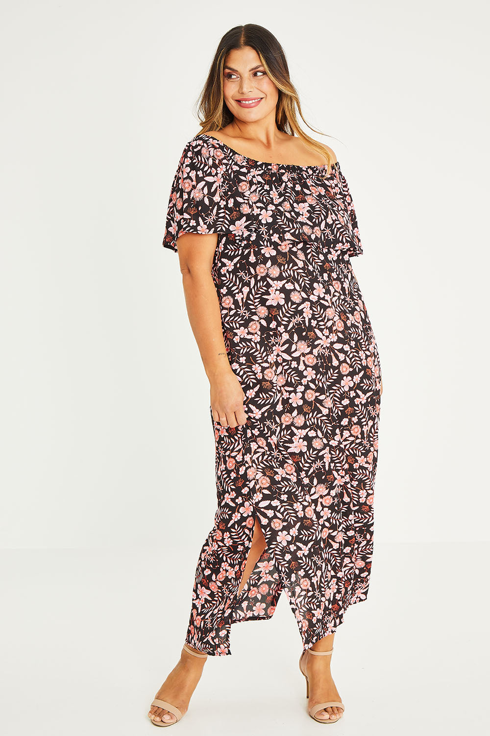 Model Palatina wearing size 16 of The Printed Isabel Dress in colour Summertime (Black), from the front, showing the whole outfit