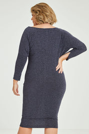 Model Fiona wearing size 16 of the Loreley Dress in colour Twilight (Blue), from the back