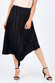 Model Rebecca wearing size 10 of the Yen Skirt in colour Black (Black), from the front, cropped image