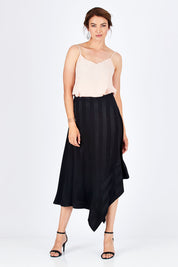 Model Rebecca wearing size 10 of the Yen Skirt in colour Black (Black), from the front, showing the whole outfit