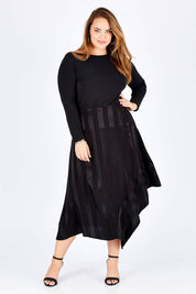 Model Sophie wearing size 14 of the Yen Skirt in colour Black (Black), from the front, showing the whole outfit