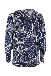 Product shot of The Printed Kelly Blouse in colour Navyleaves (Blue), from the back