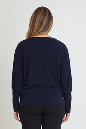 Model Chanel wearing size 16 of the Kelly Blouse in colour Navy (Blue), from the back
