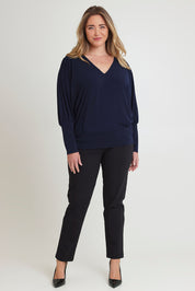 Model Chanel wearing size 16 of the Kelly Blouse in colour Navy (Blue), from the front, showing the whole outfit