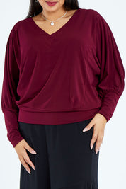 Model Sasha-Lee wearing size 16 of the Kelly Blouse in colour Port (Red), from the front, cropped image