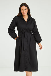 Model Laura wearing size 14 of the Jane Shirt Dress in colour Black (Black), from the front, cropped image