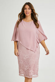 Model Laura wearing size 14 of the Marnie Dress in colour Dustyrose (Pink), from the front, cropped image