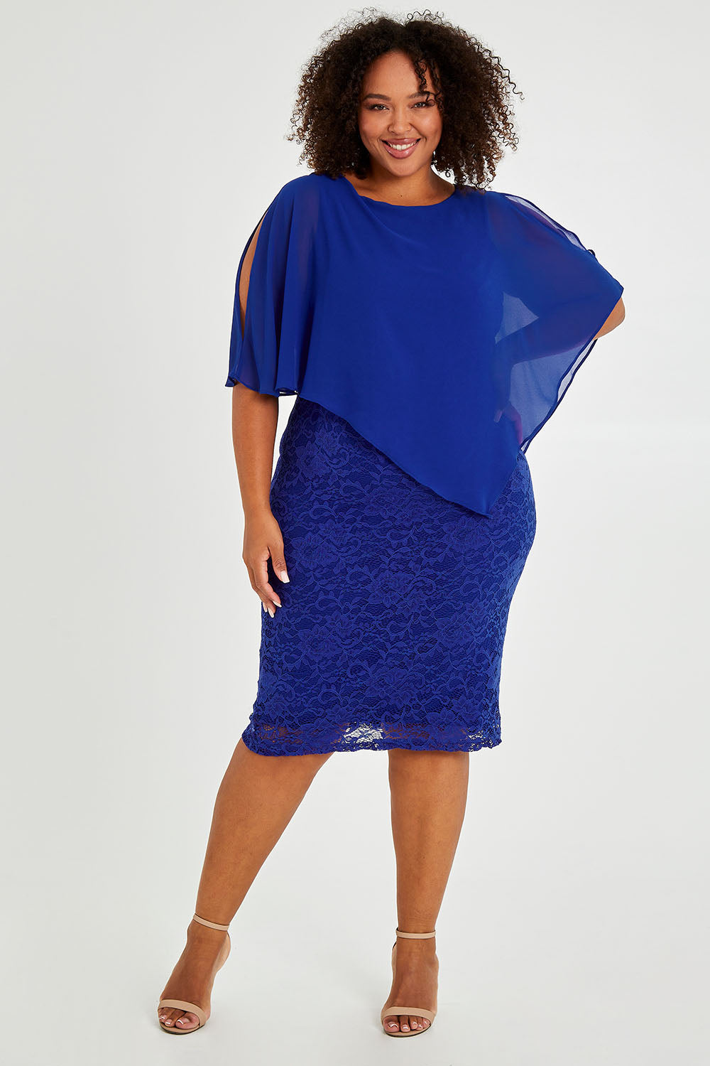 Model Alexis wearing size 16 of the Marnie Dress in colour Sapphire (Blue), from the front, showing the whole outfit