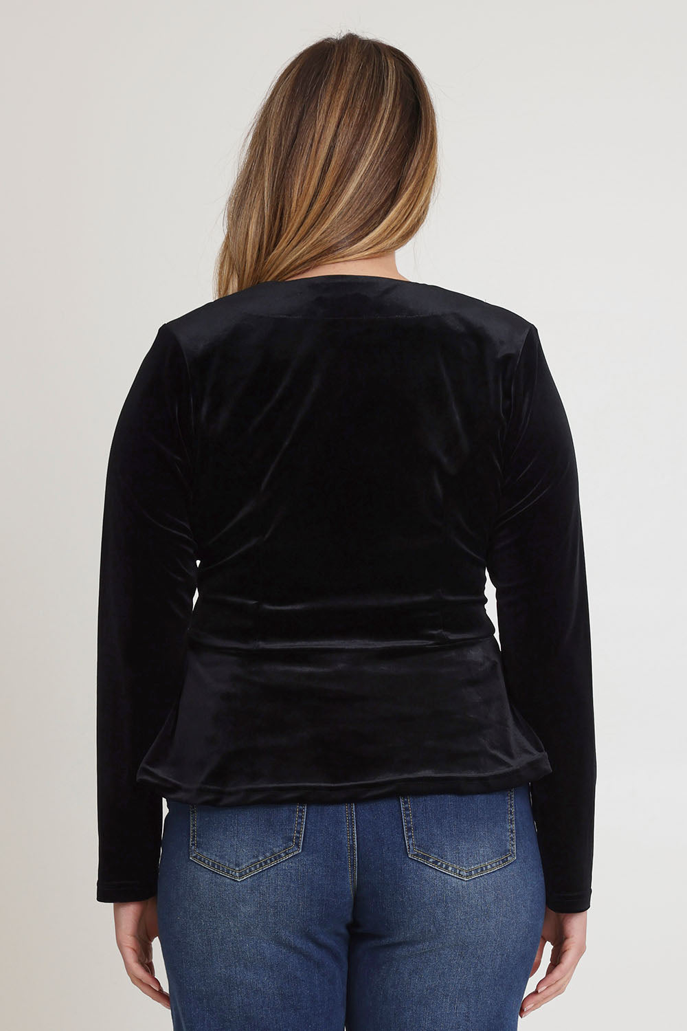 Model Chanel wearing size 16 of the Dawn Velvet Jacket in colour Black (Black), from the back