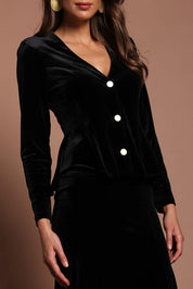 Model Madeline wearing size 10 of the Dawn Velvet Jacket in colour Black (Black), from the front, cropped image