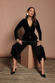 Model Madeline wearing size 10 of the Dawn Velvet Jacket in colour Black (Black), from the front, showing the whole outfit