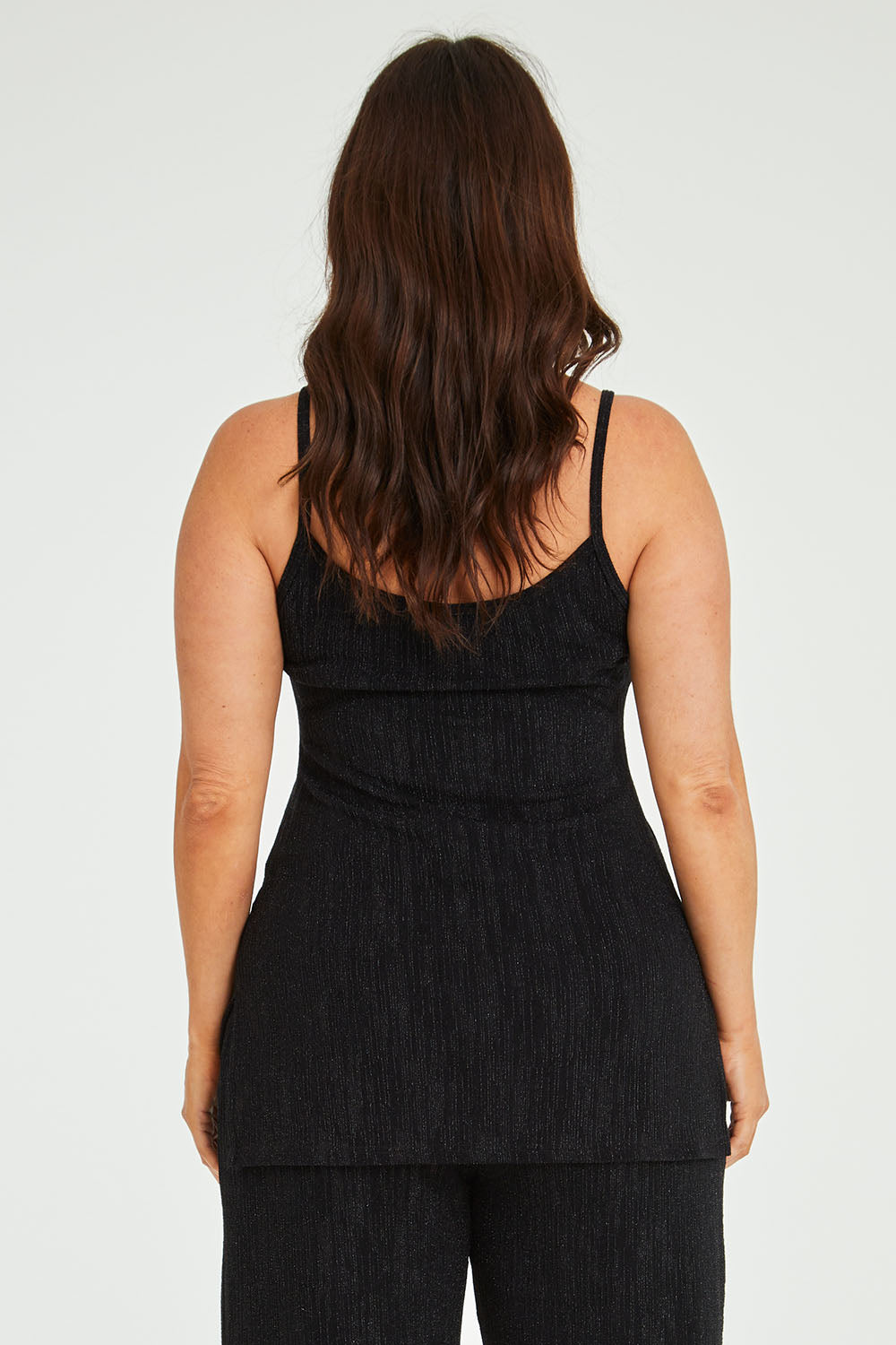 Model Laura wearing size 14 of the Donna Glamorous Top in colour Midnight (Black), from the back