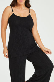 Model Laura wearing size 14 of the Donna Glamorous Top in colour Midnight (Black), from the front, cropped image