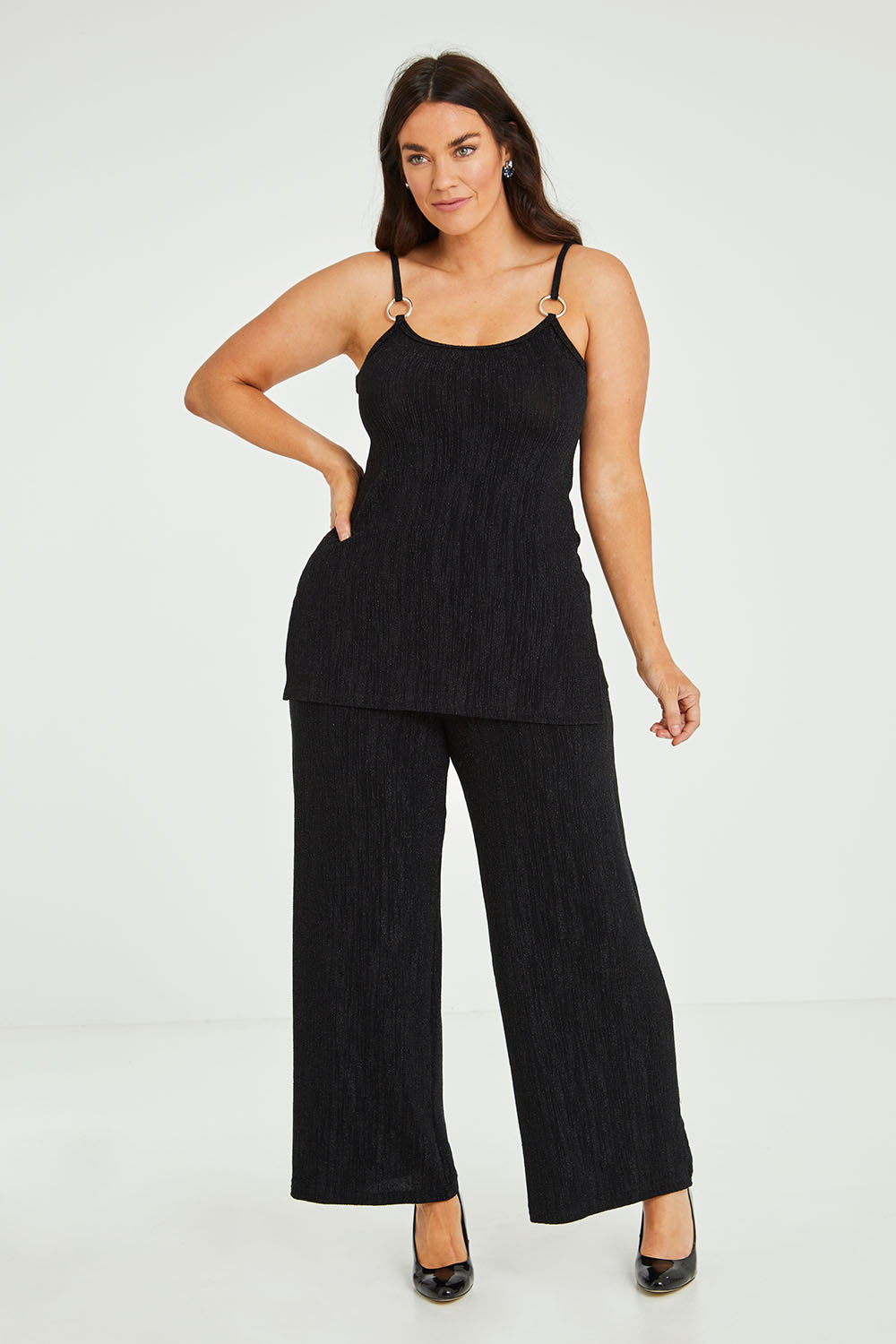 Model Laura wearing size 14 of the Donna Glamorous Top in colour Midnight (Black), from the front, showing the whole outfit