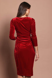 Model Madeline wearing size 10 of the Diana Velvet Dress in colour Garnet (Red), from the back