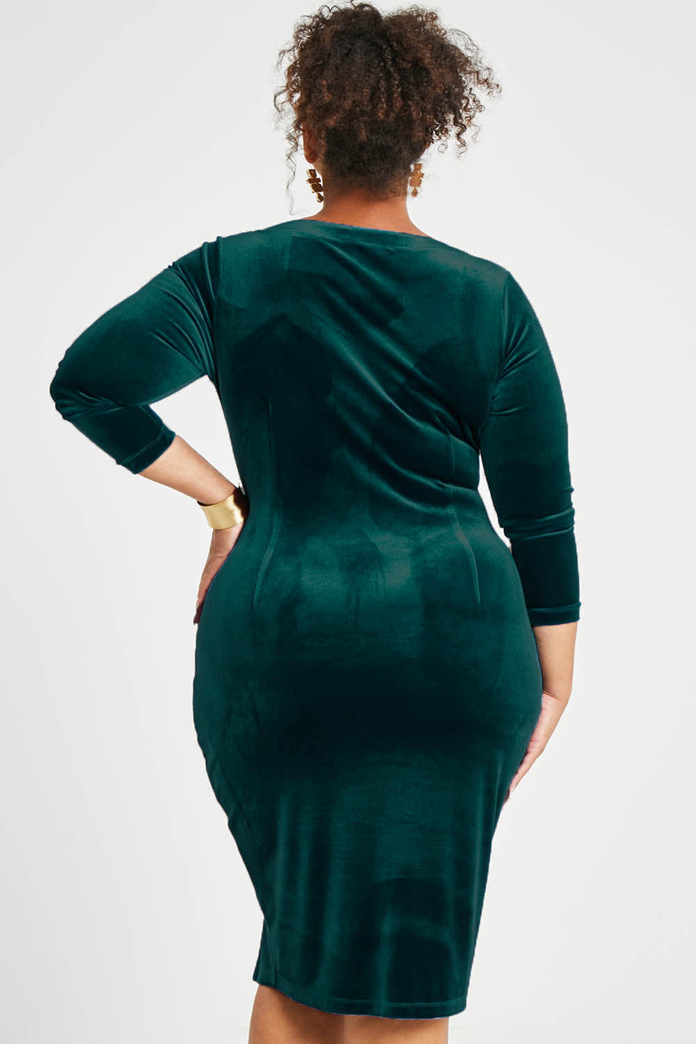 Model Alexis wearing size 16 of the Diana Velvet Dress in colour Ivy (Green), from the back