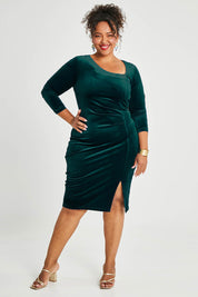 Model Alexis wearing size 16 of the Diana Velvet Dress in colour Ivy (Green), from the front, showing the whole outfit