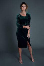 Model Emma wearing size 10 of the Diana Velvet Dress in colour Ivy (Green), from the front, showing the whole outfit