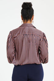 Model Noli wearing size 14 of the Heather Shirt in colour Navypink (Blue), from the back