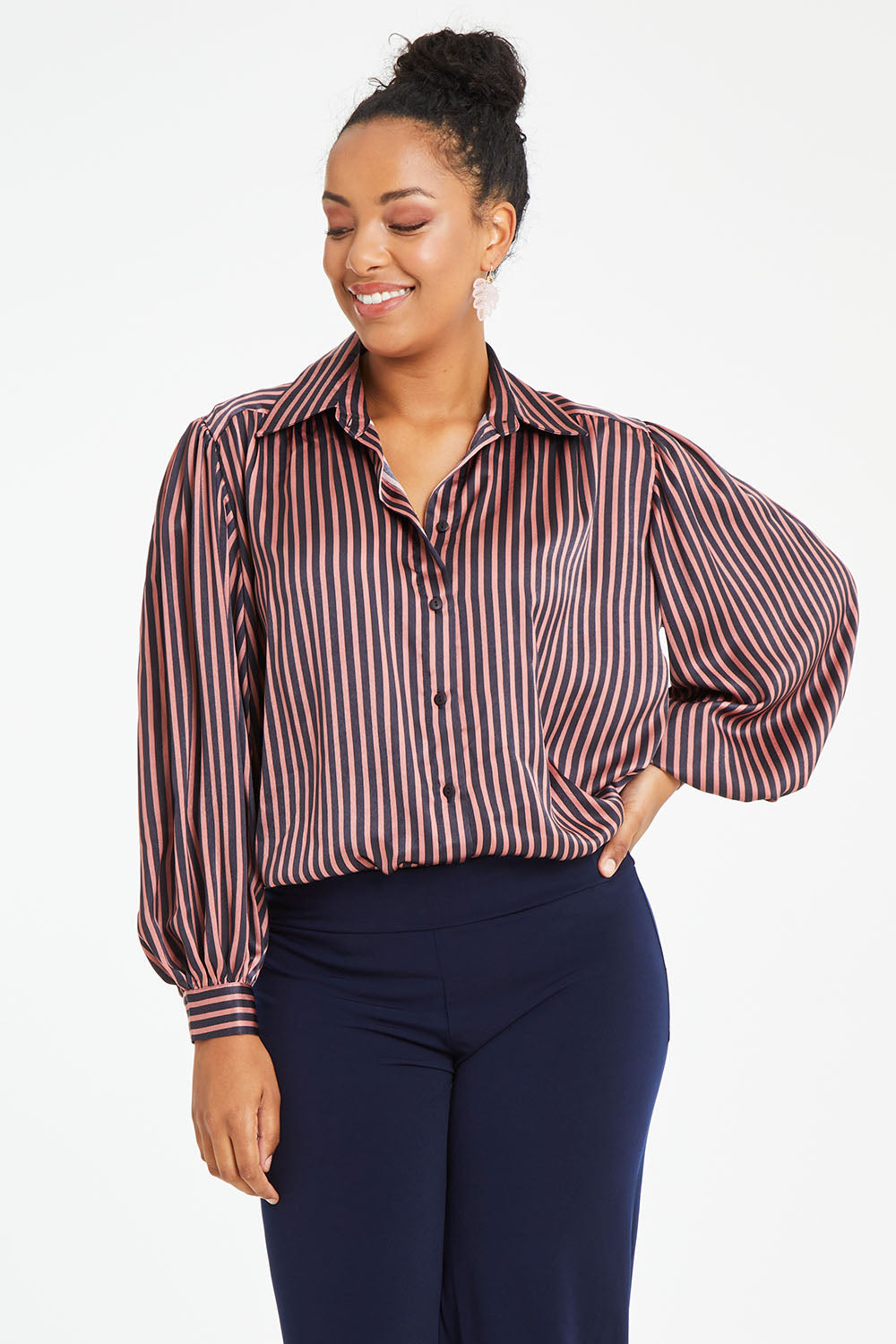 Model Noli wearing size 14 of the Heather Shirt in colour Navypink (Blue), from the front, cropped image
