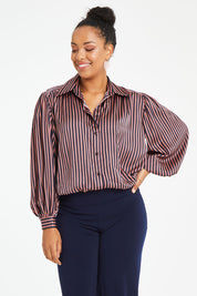 Model Noli wearing size 14 of the Heather Shirt in colour Navypink (Blue), from the front, cropped image