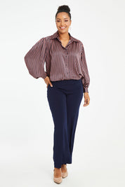 Model Noli wearing size 14 of the Heather Shirt in colour Navypink (Blue), from the front, showing the whole outfit