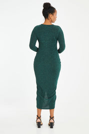 Model Noli wearing size 14 of the Carolyn Dress in colour Forest (Green), from the back